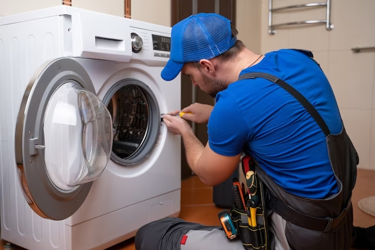 working-man-plumber-repairs-washing-machine-home-washing-machine-installation-repair-plumber-connect